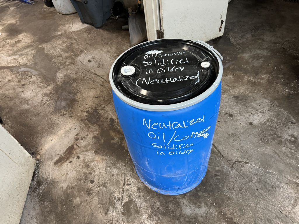 55 gallon drum of oil dry waste for disposal