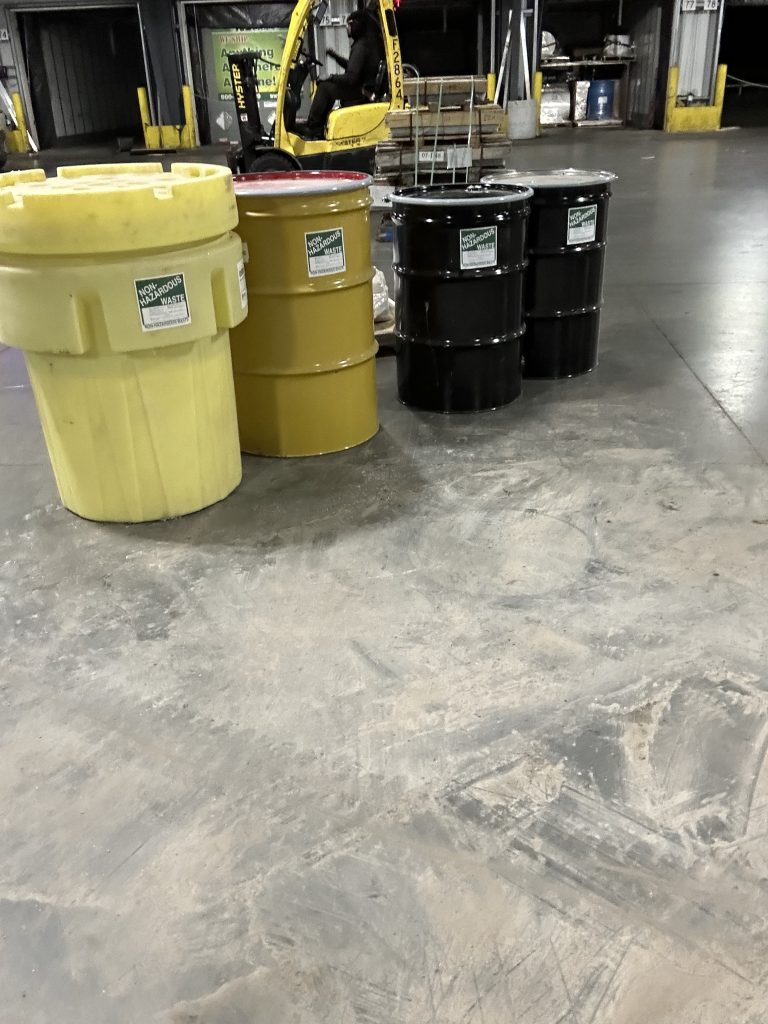 sealed waste drums and overpack drums on job site